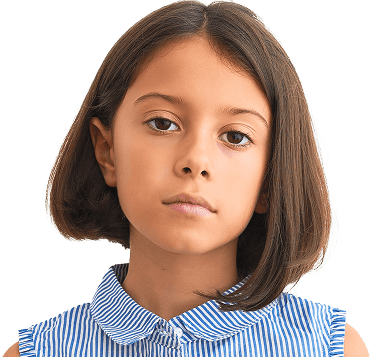 Young girl with straight brown hair, wearing a sleeveless blue and white striped blouse, standing with a neutral expression.
